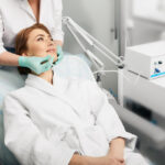 a dentist performing ozone therapy on a patient.